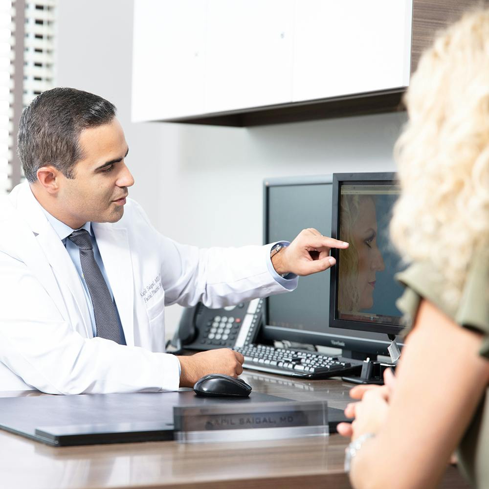 Dr. Saigal with a patient