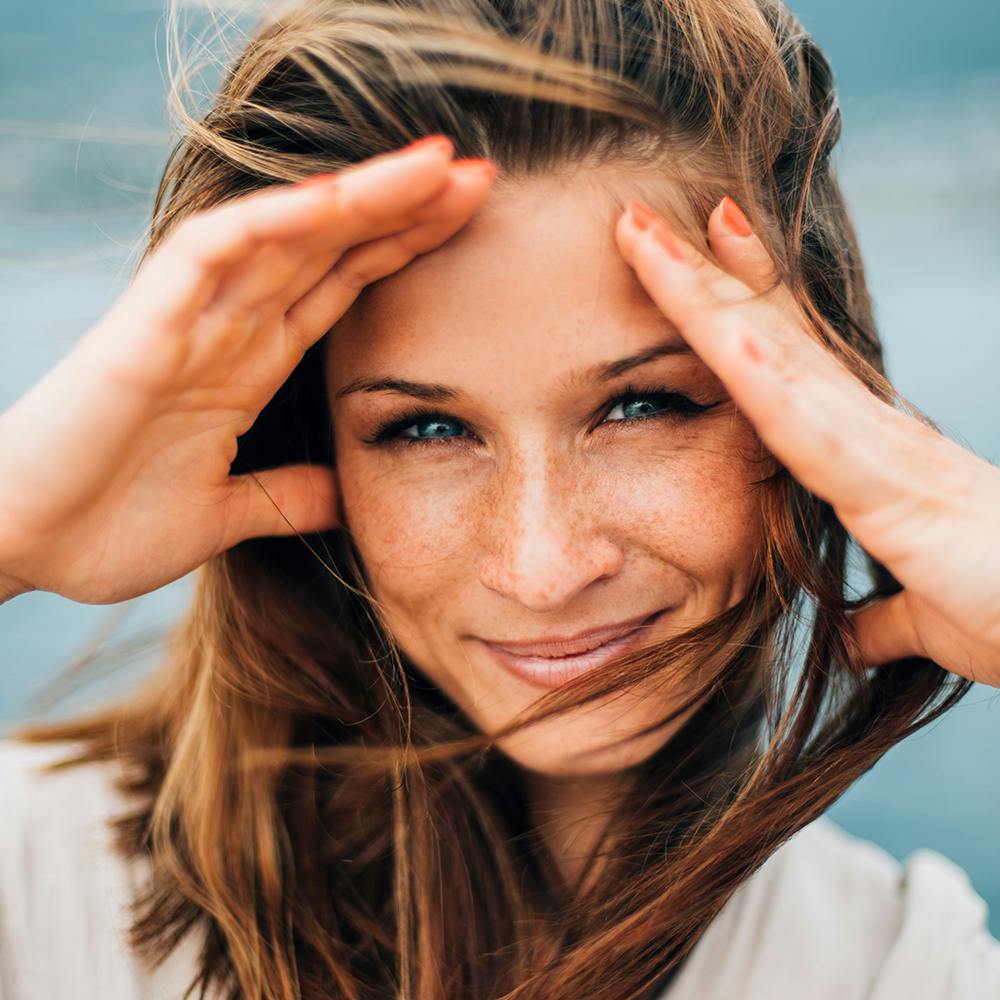 woman with her hands up