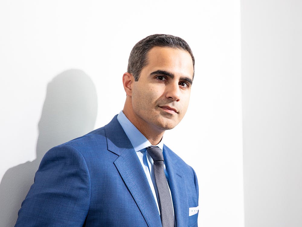 man leaning against wall