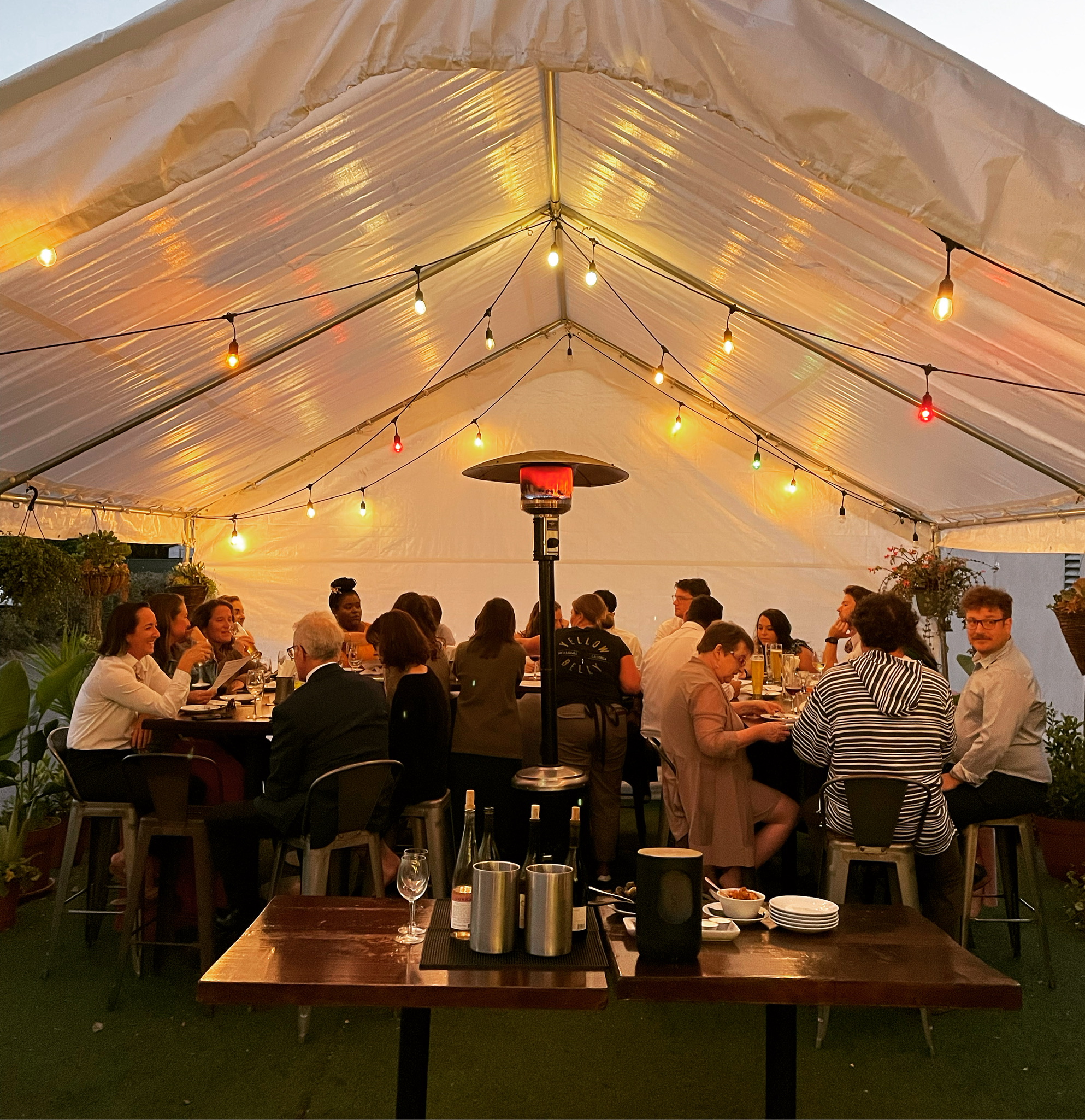 People eating together in a covered area