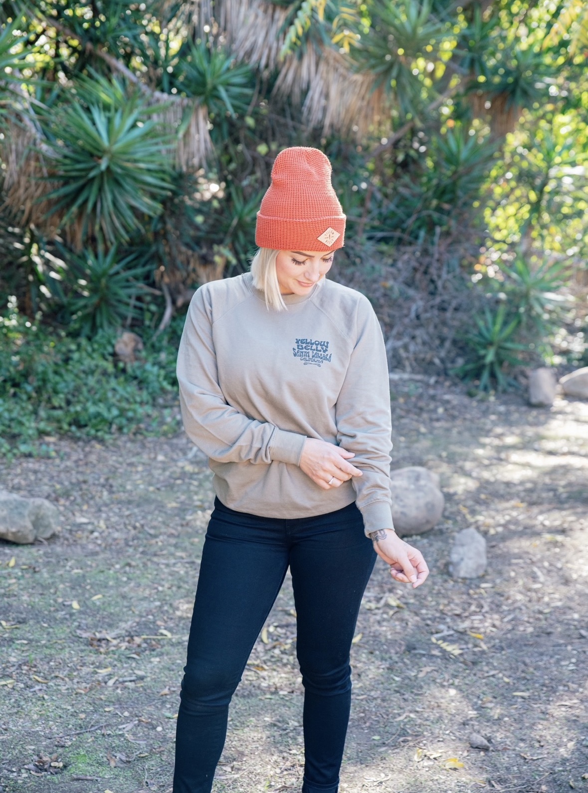 Girl wearing a Yellow Belly crewneck sweatshirt