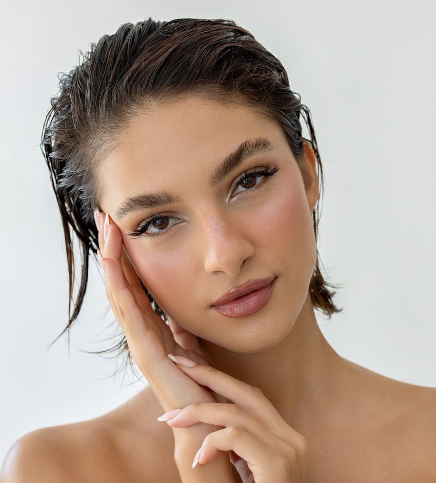 Woman with hand on face