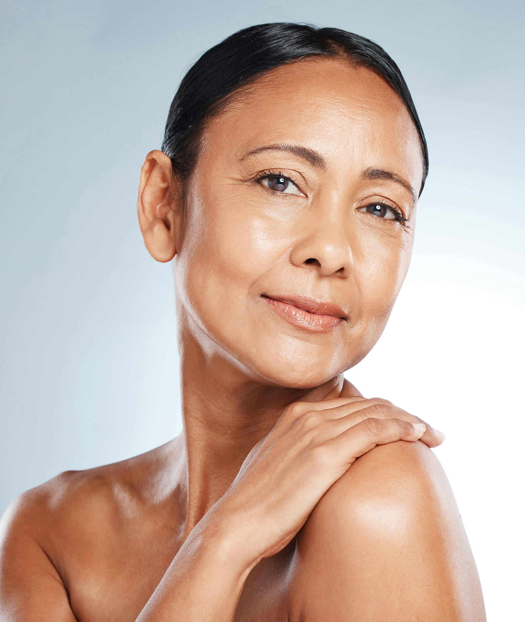 Woman touching shoulder