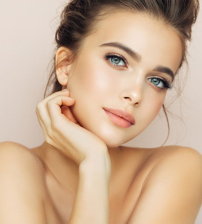 Woman resting chin on hand