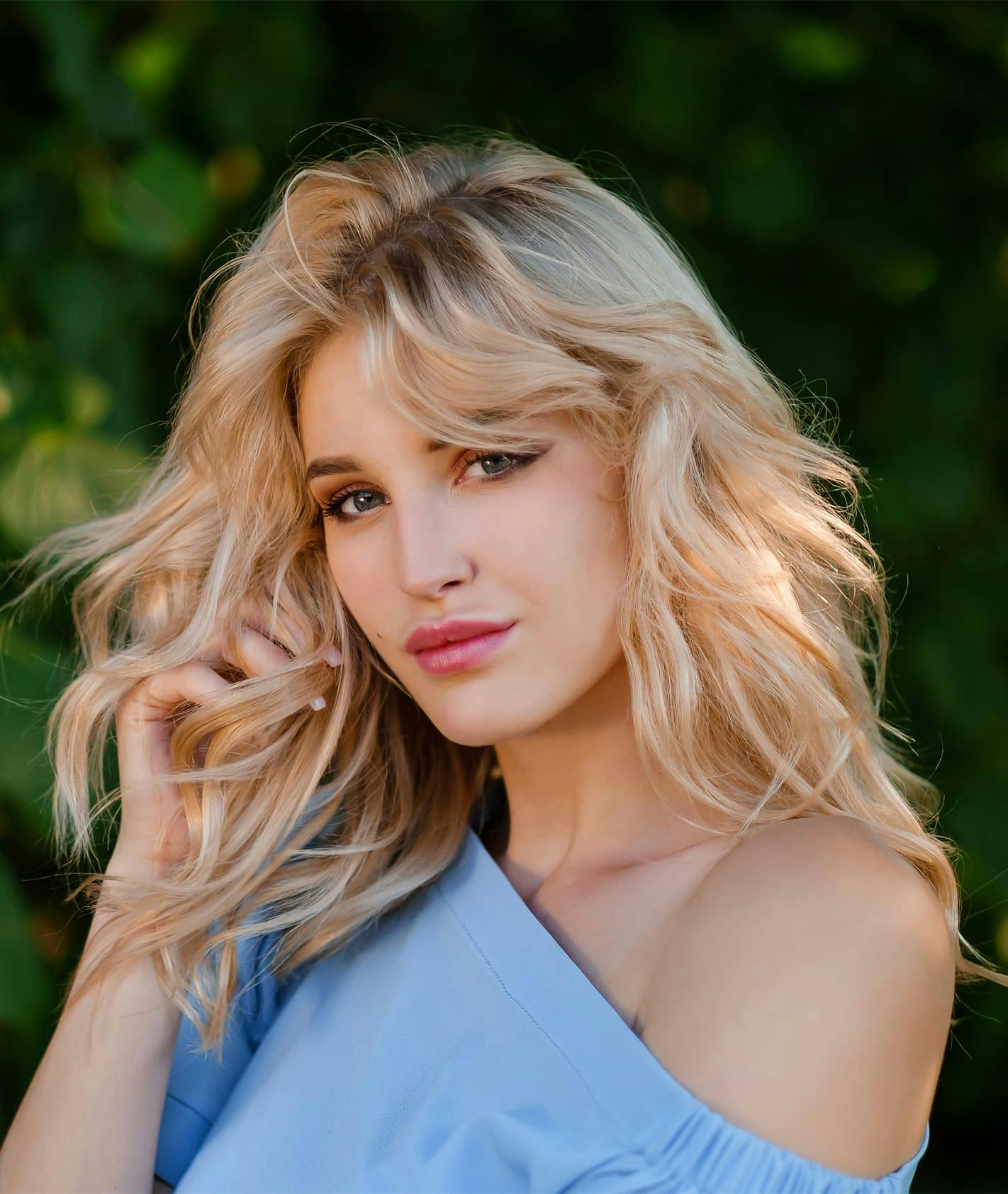 Woman running hand through hair