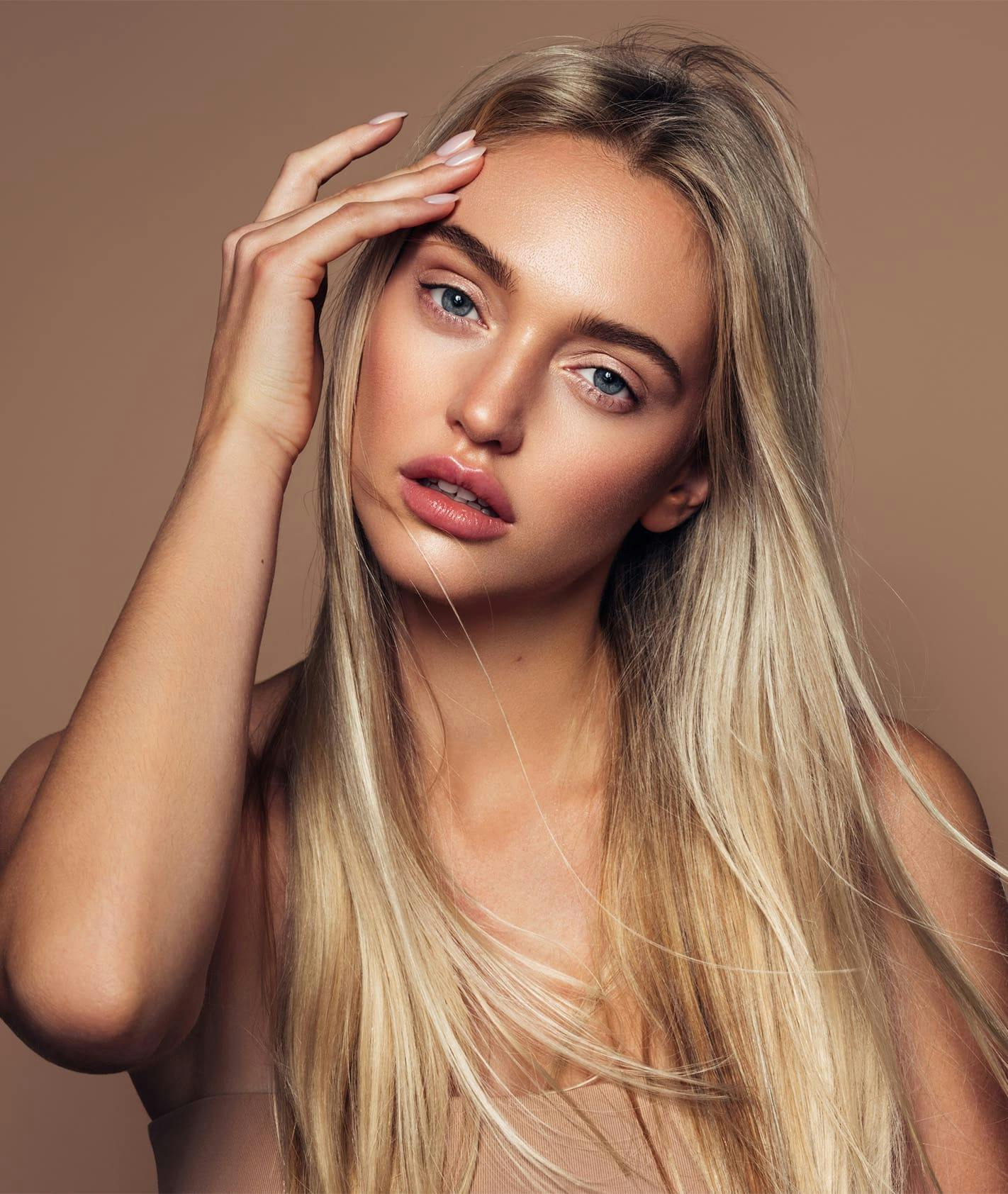 Woman wouching eyebrow