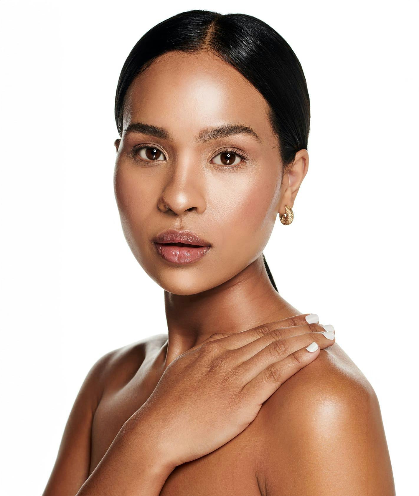 Woman with hand on chest