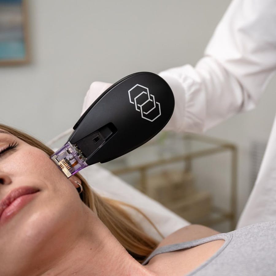 Woman holding a baby against her