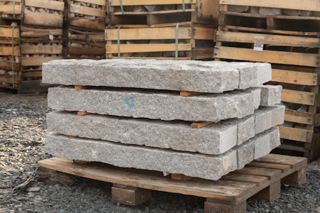 Grey split kerbs on a wooden pallet