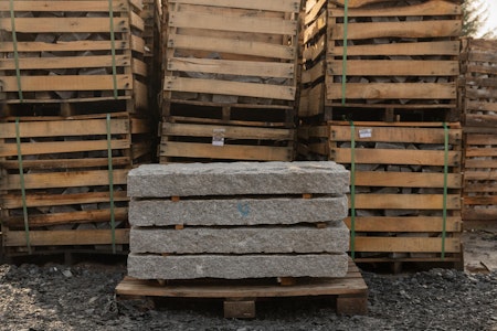 2000 x 200 z 100mm granite kerbs on a wooden pallet