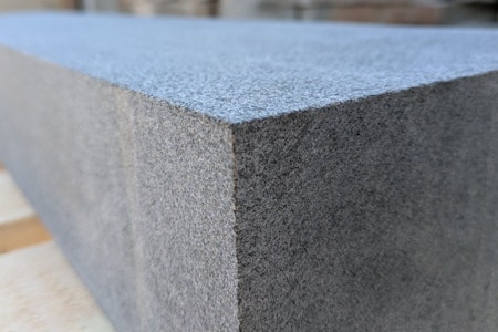 Close up of a medium grey finished kerb