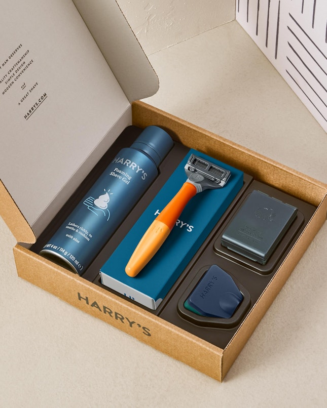 Harry's truman set with orange handle, shave gel, blades and travel blade cover