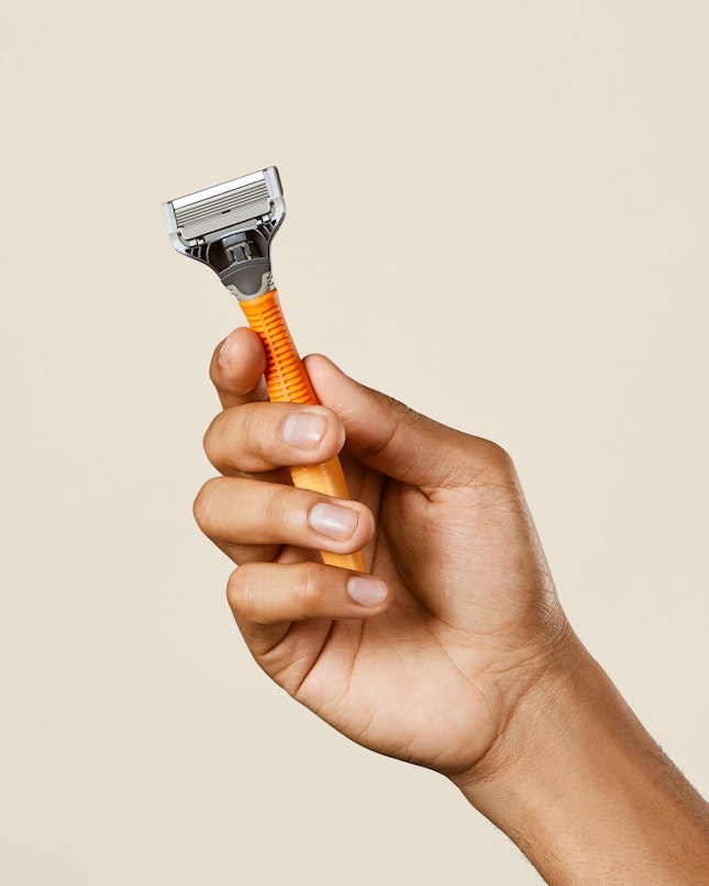 Harry's orange truman razor handle with one blade