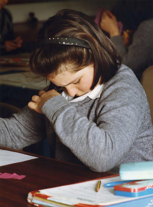 I was exploring the poignant time in a girl’s life between 11-14 years. Three strands: Home, School and Fantasies made the framework I used for the pictures. Lynn, 11, at school, Bath 1991, Entering the Masquerade 1992.