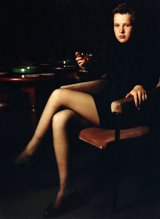 Liane had chosen this 2 weeks before and when I came back to photograph her she had borrowed a dress from her mum, and changed her hair. I set the picture in a local club, where we borrowed the glass for her lemonade. Liane, 14, ‘Looking Older’, 1992, Entering the Masquerade 1992.