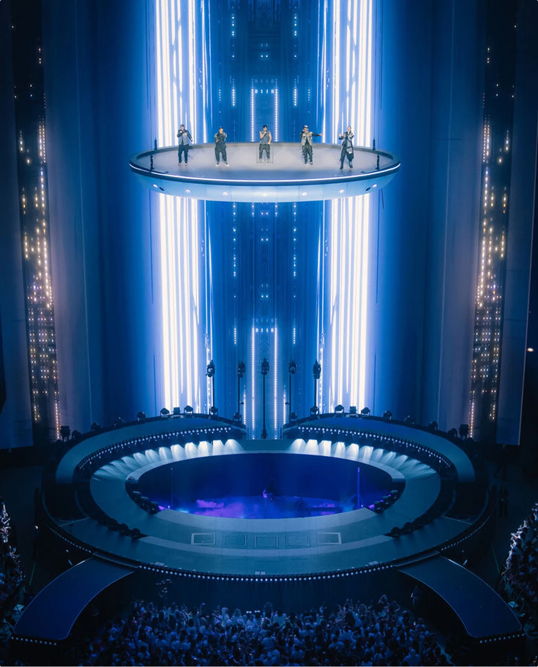 Backstreet Boys perform on a flying stage with light beam content behind them at Sphere Las Vegas - designed by Silent House