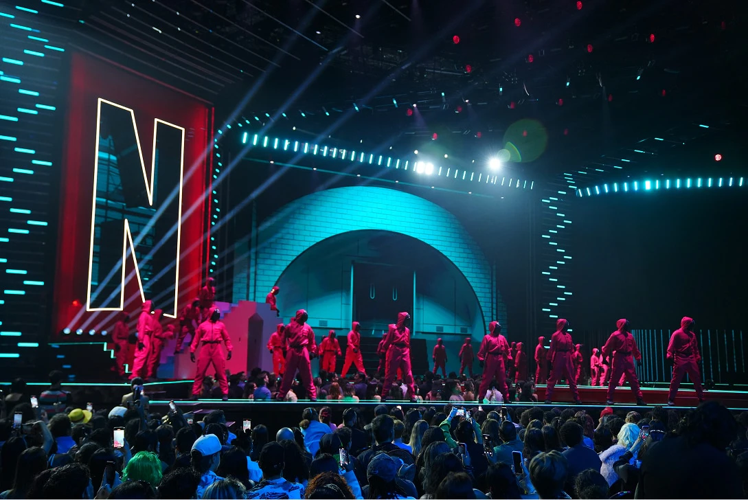 Pink Guards from Netflix's Squid Game dance on stage at Netflix Tudum 2025