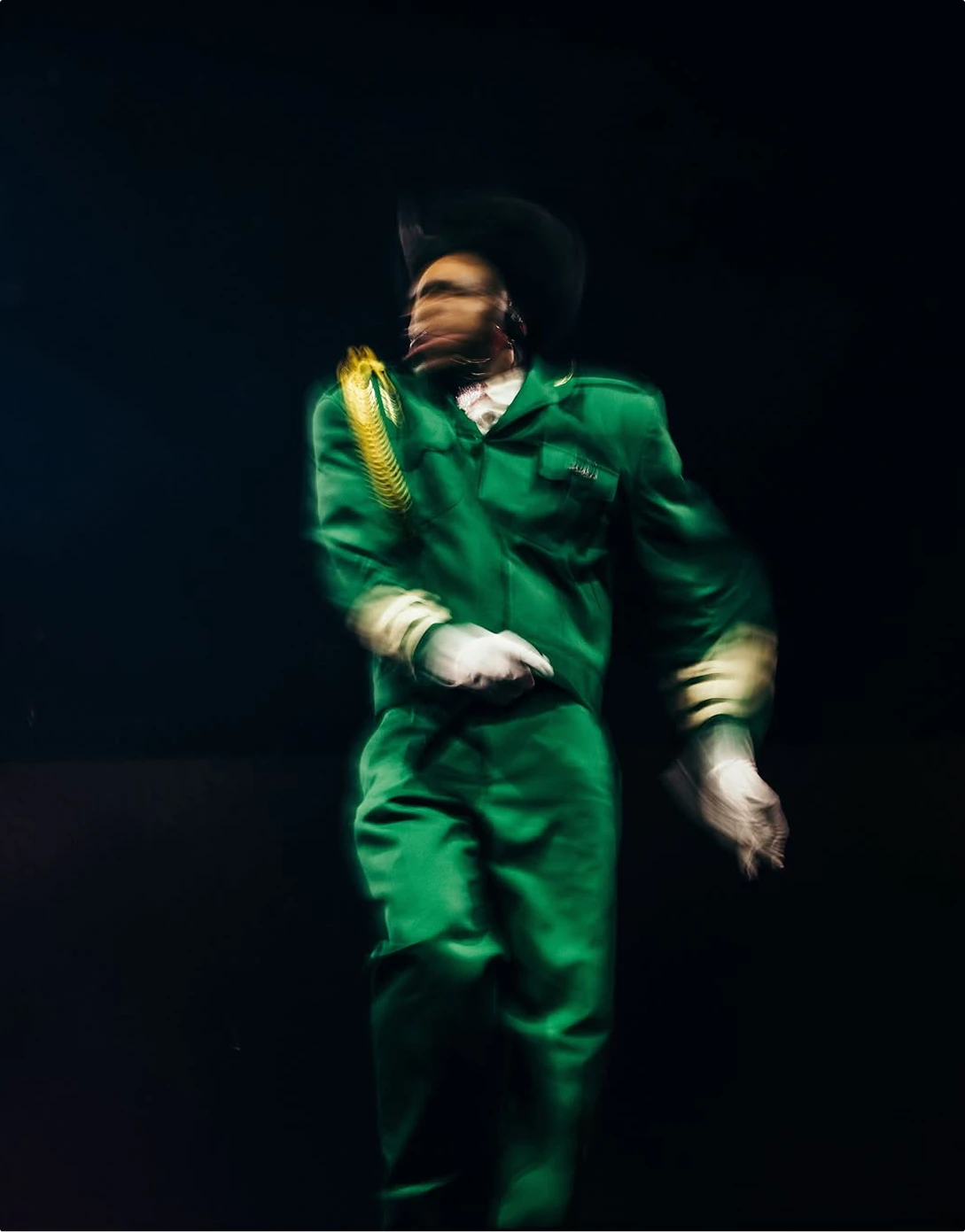 Tyler, The Creator - CHROMAKOPIA Tour - Silent House - Photo by Shaun Llewellyn Tyler, the Creator in green marching suit action shot motion blur