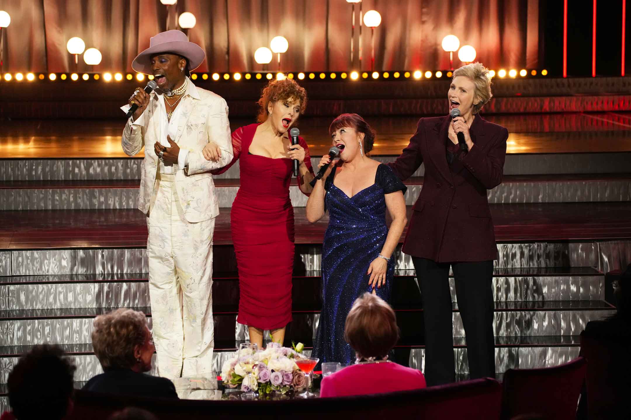 Billy Porter, Bernadette Peters, Aileen Quinn, and Jane Lynch sing "Tomorrow" from the musical Annie in front of Carol Burnett and Julie Andrews during NBC's broadcast of Carol Burnett: 90 Years of Laughter + Love