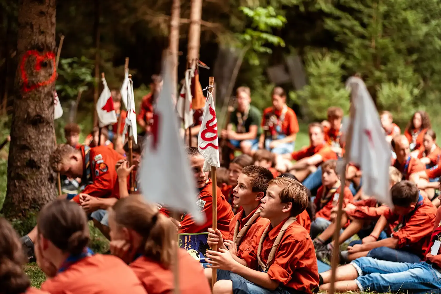 Scouts in uniforms sitting