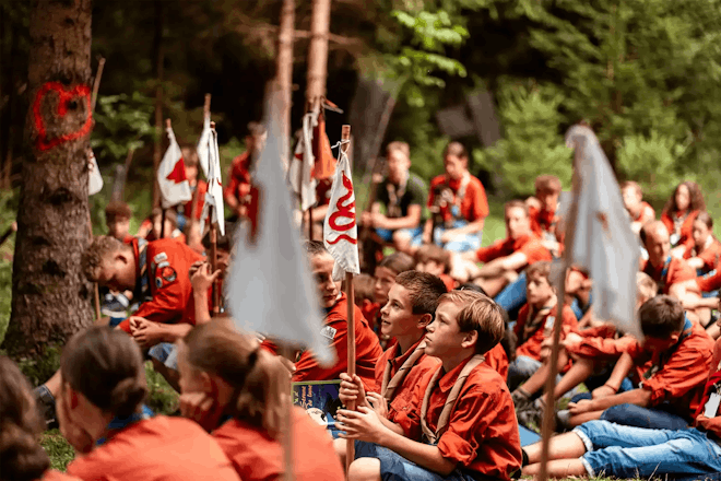 Scouts in uniforms sitting