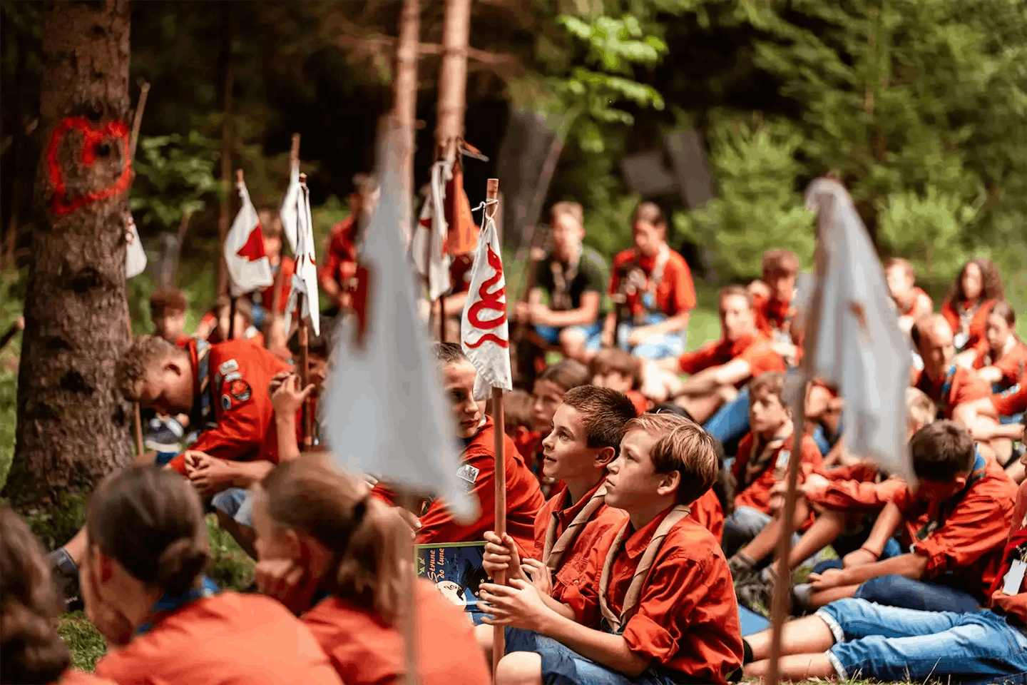 Scouts in uniforms sitting