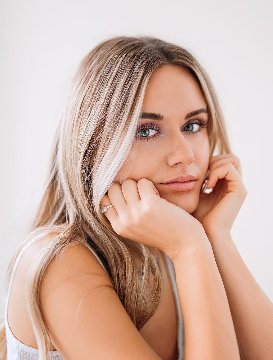 Woman with her hands to her face