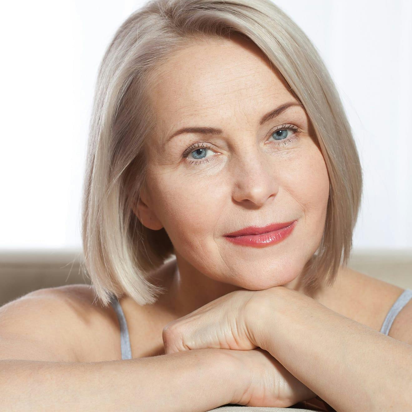 woman resting her head on her hands