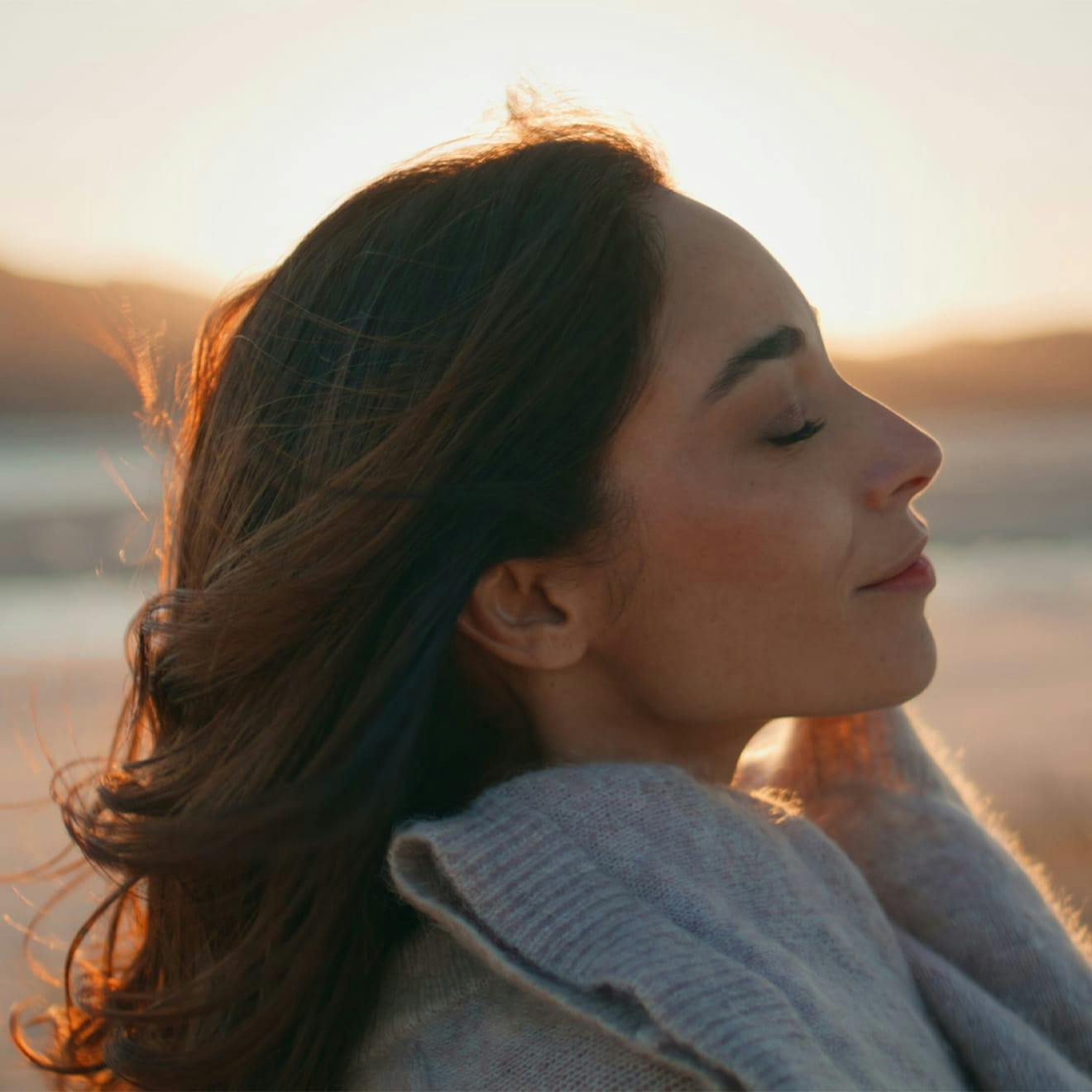 woman sitting on a beach