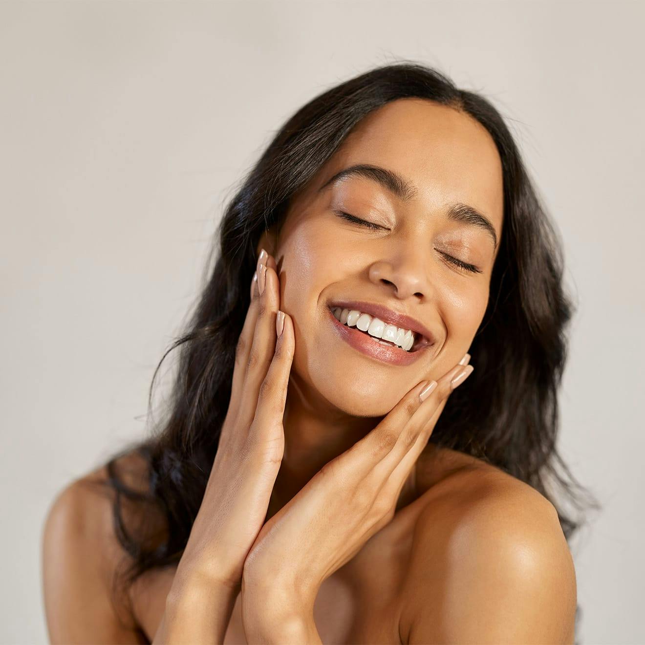 woman touching her face