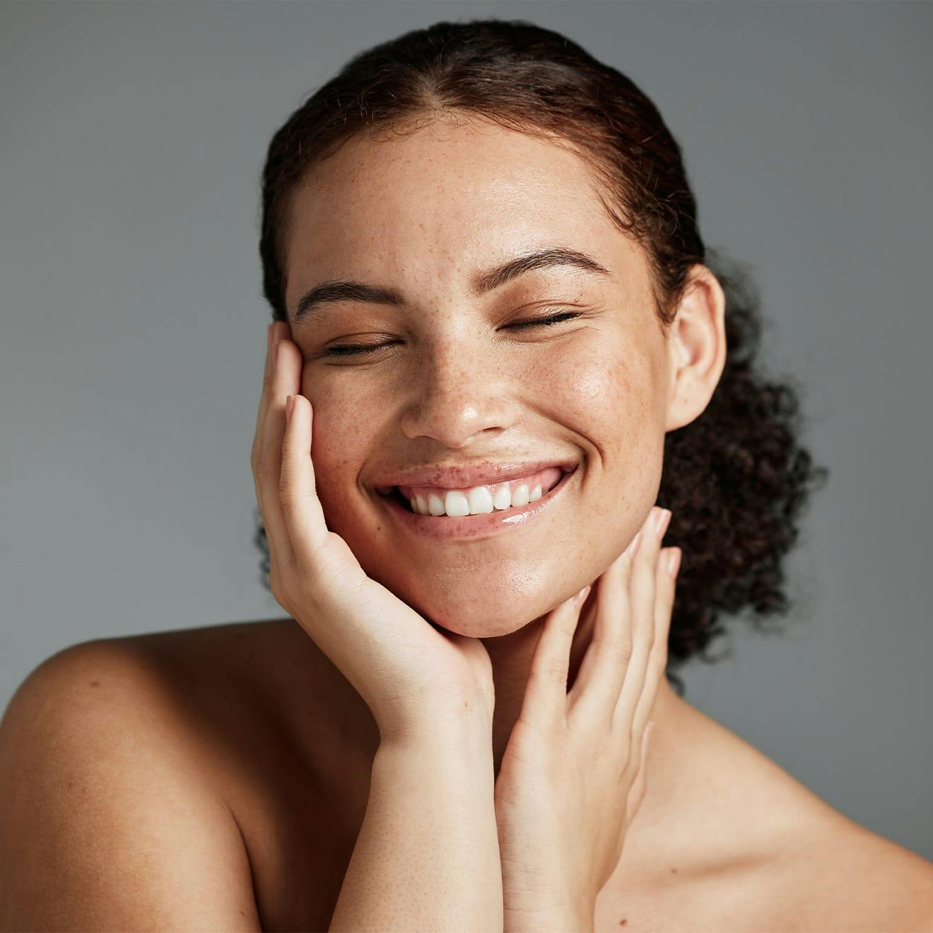 woman touching her face