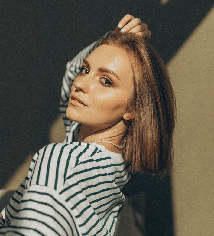 woman looking over her shoulder