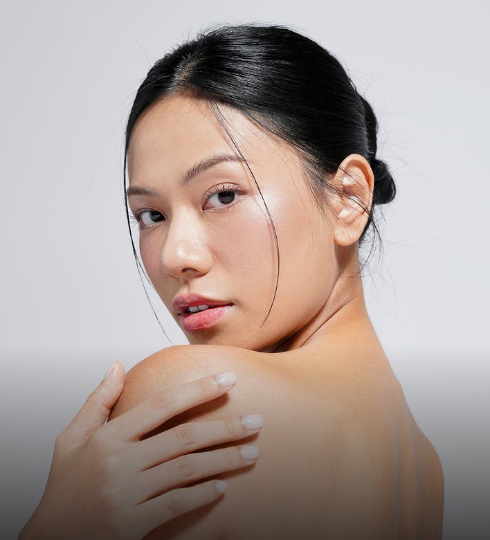 Woman looking over her shoulder