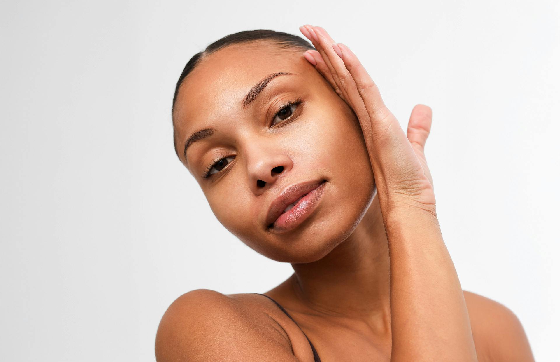 woman with her hand on the side of her face