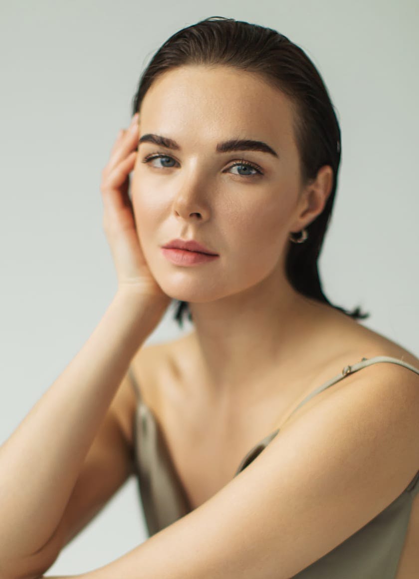 Woman with a hand to her face