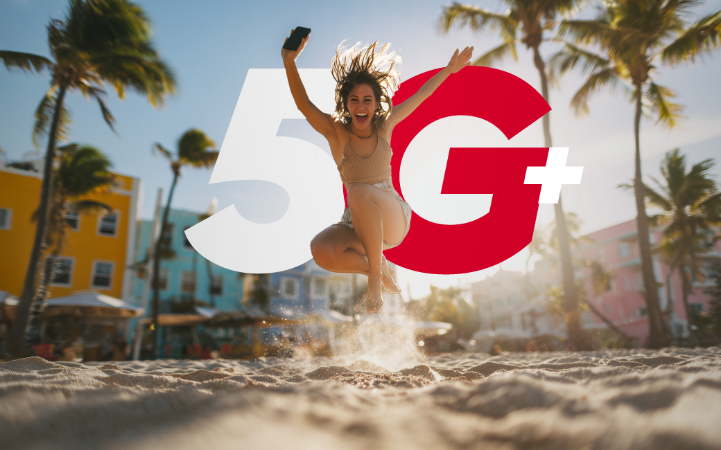 Lady enjoying 5G+ on the beach