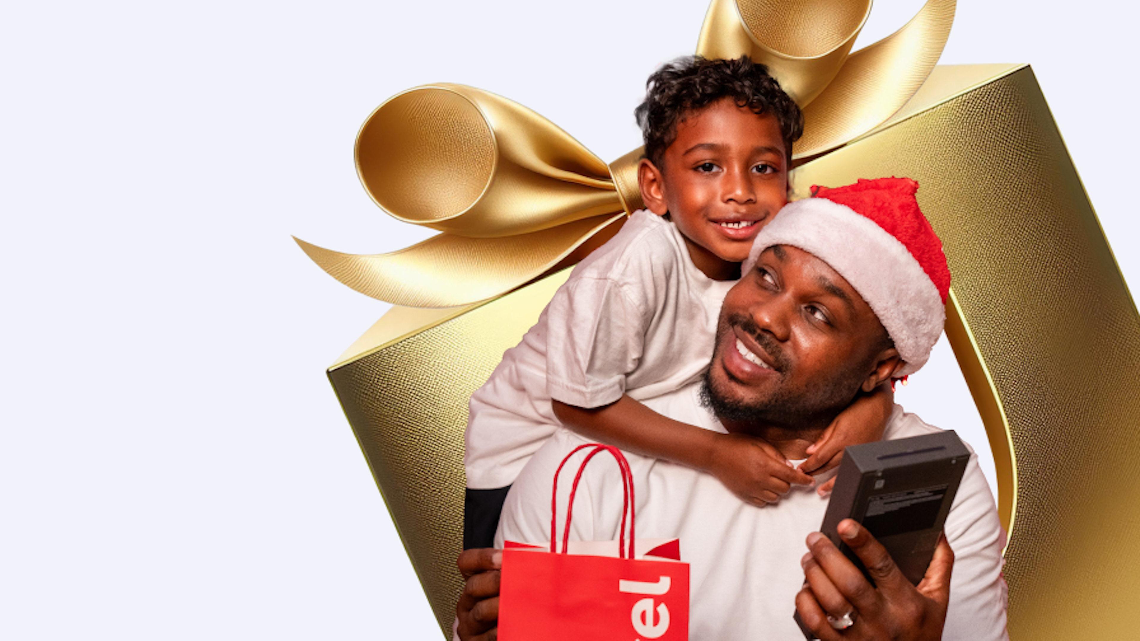 festive man and son with a smartphone
