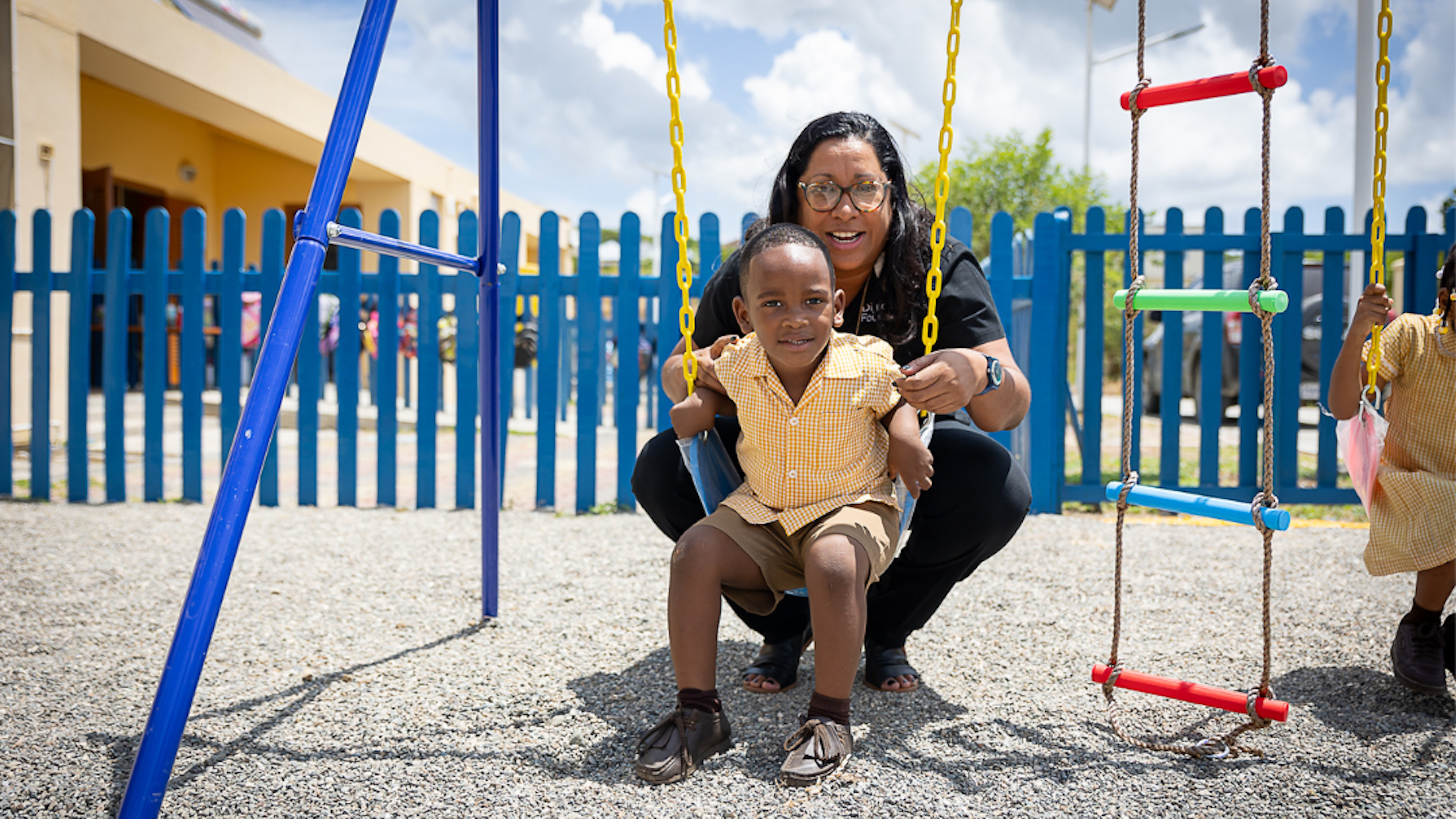 charmaine with boy on swing