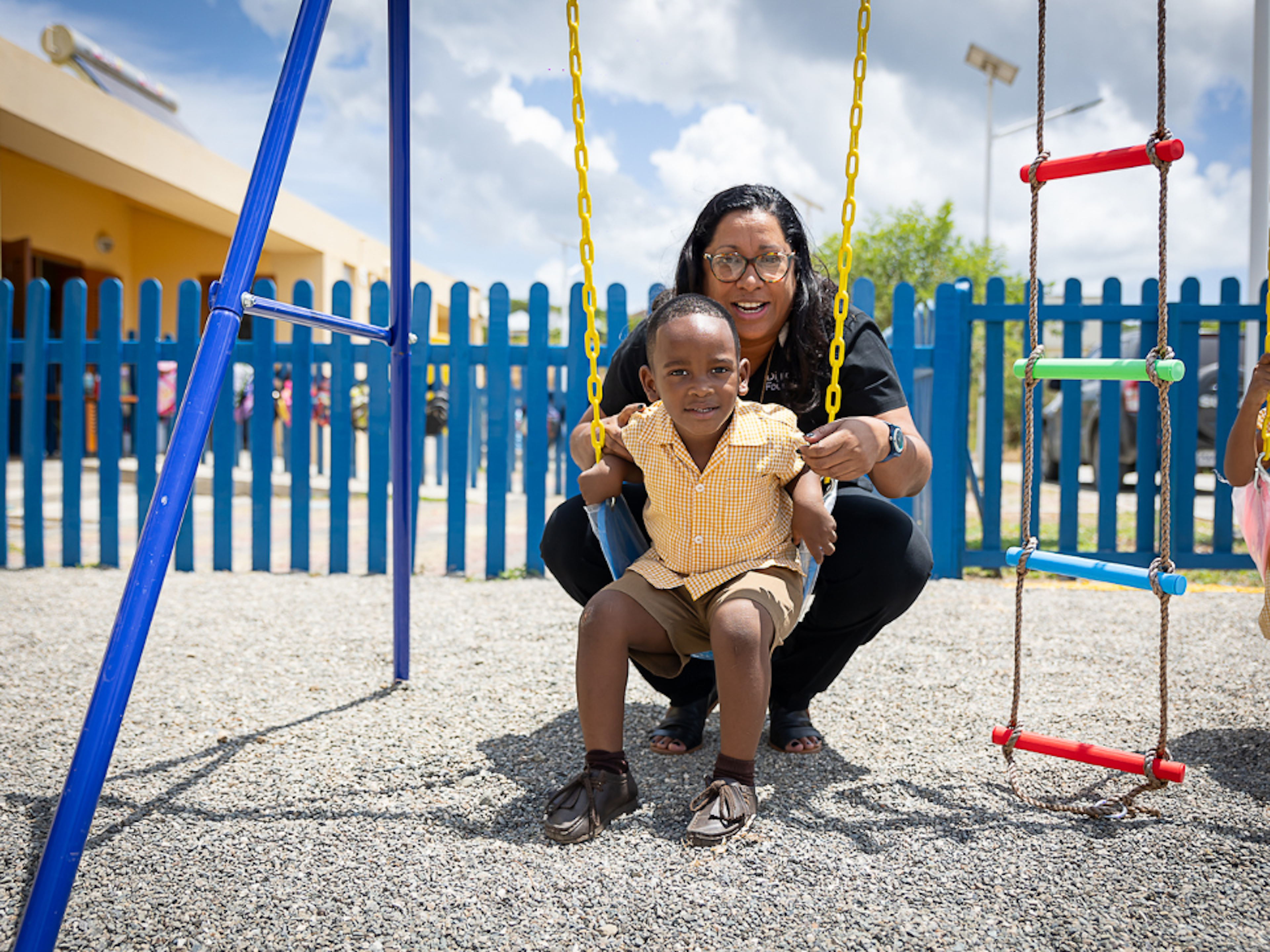 charmaine with boy on swing