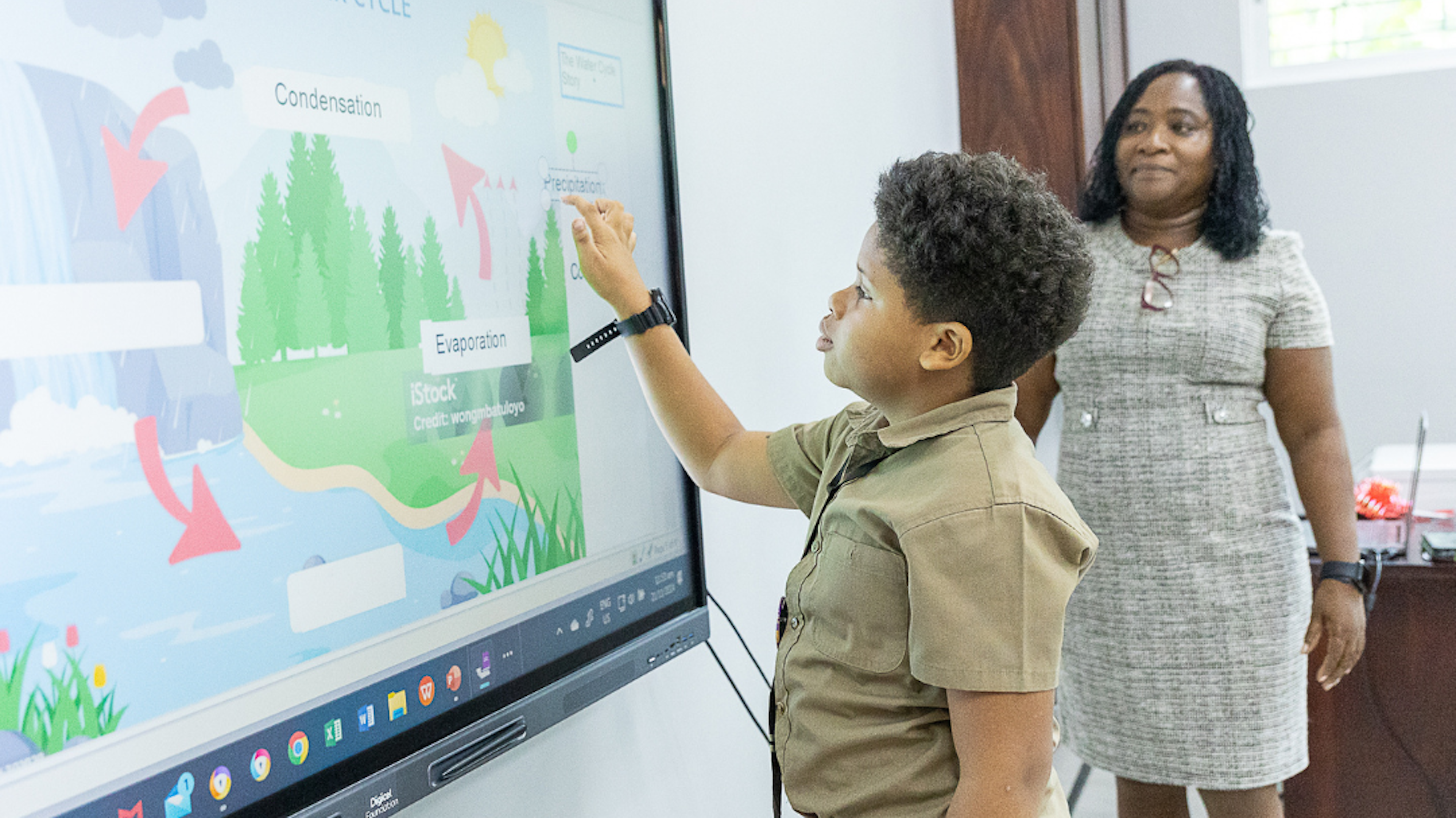 Boy and Teacher at Smart Board