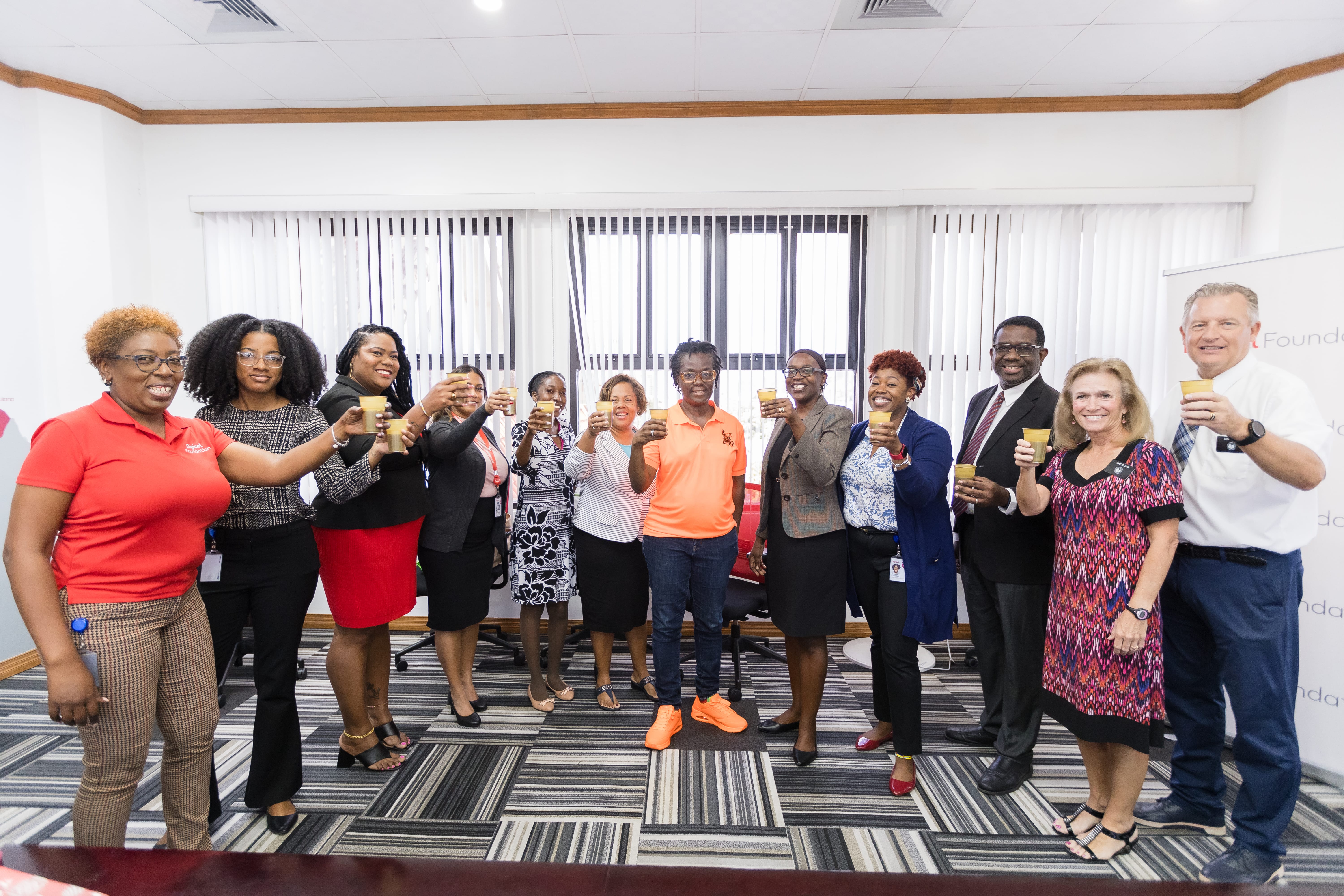 group raising glass to celebrate