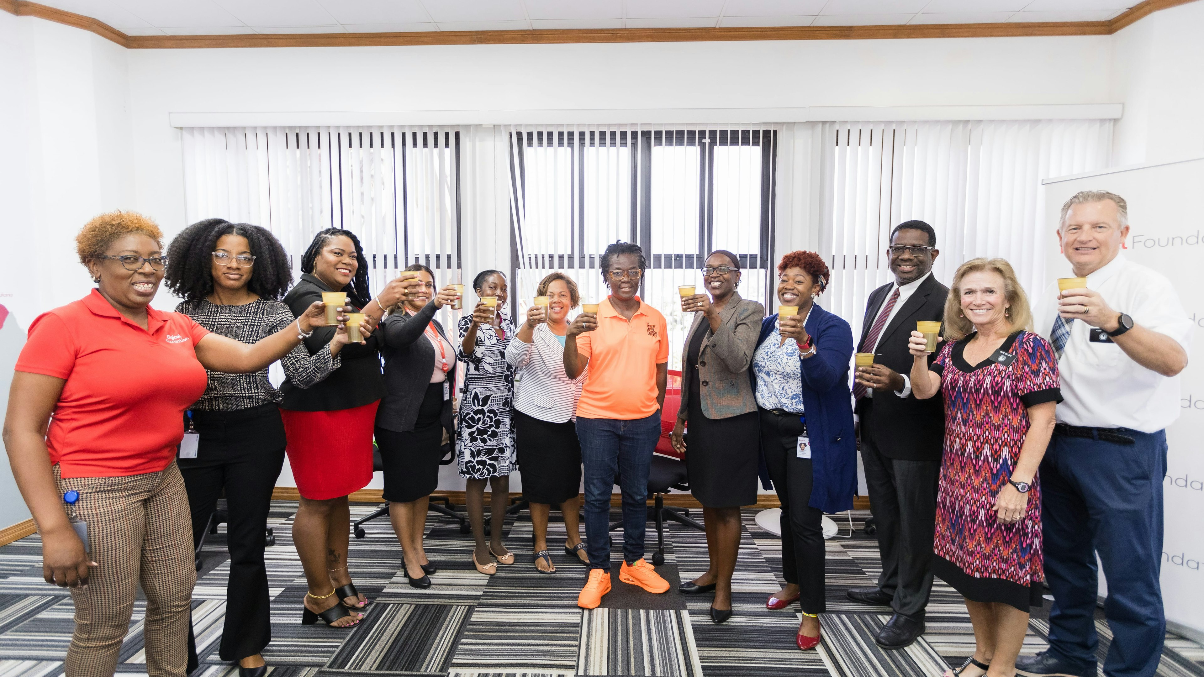 group raising glass to celebrate