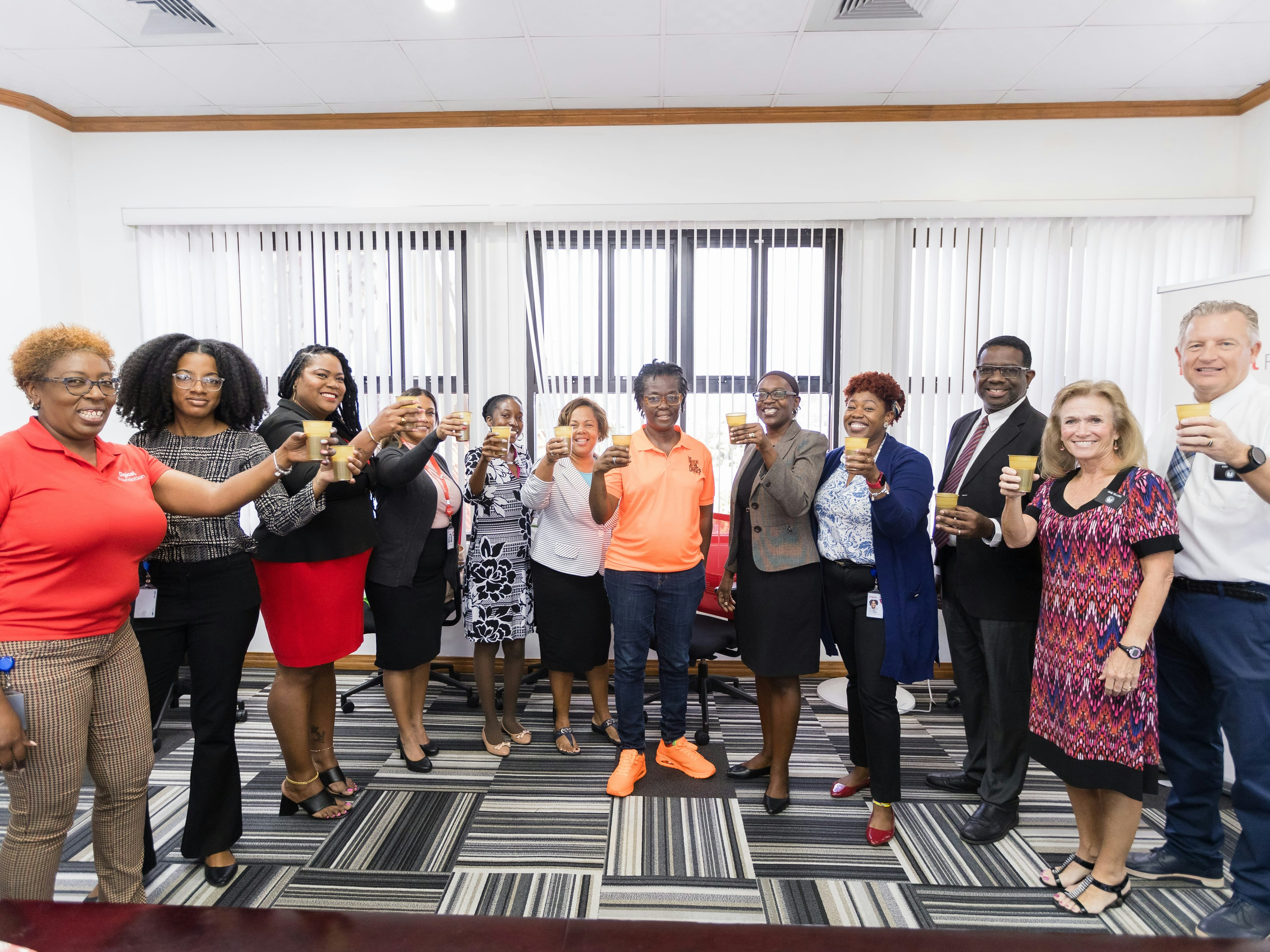 group raising glass to celebrate