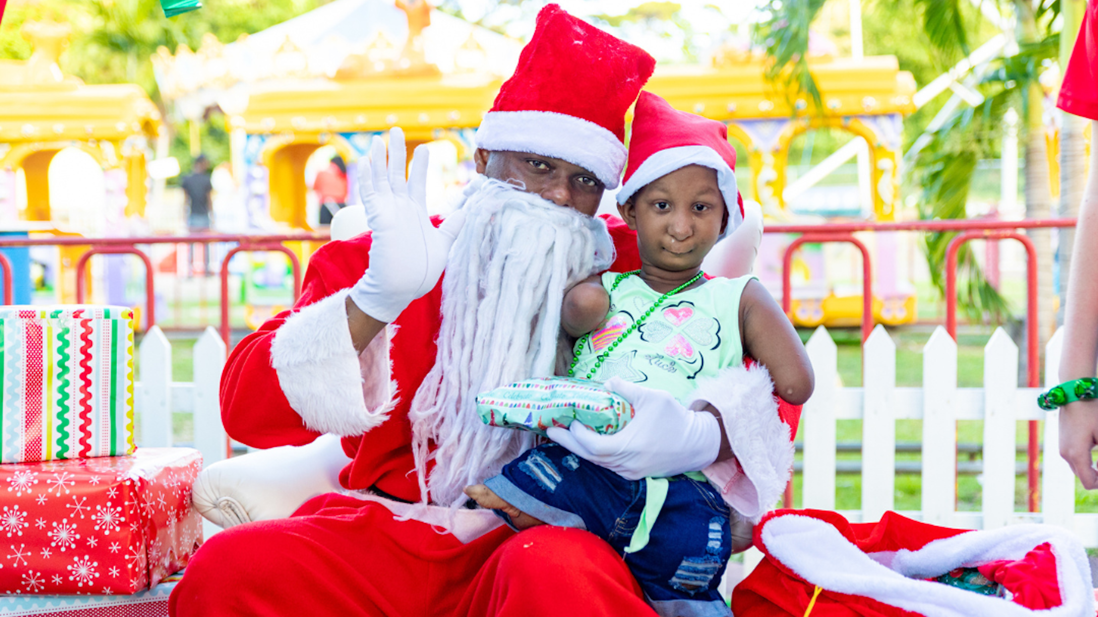 Mary sits on Santa Lap