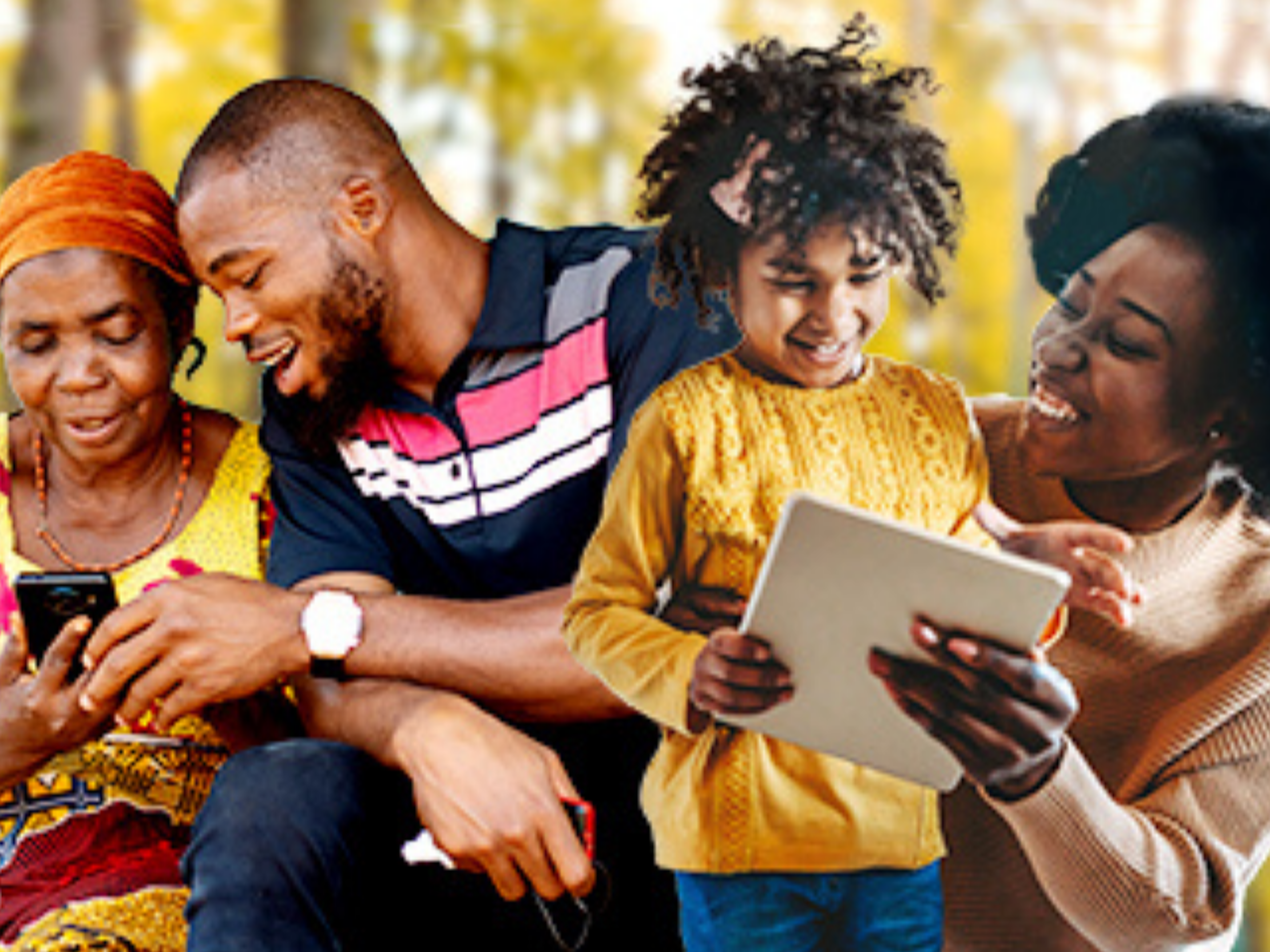 People smiling and looking at phone and tablet