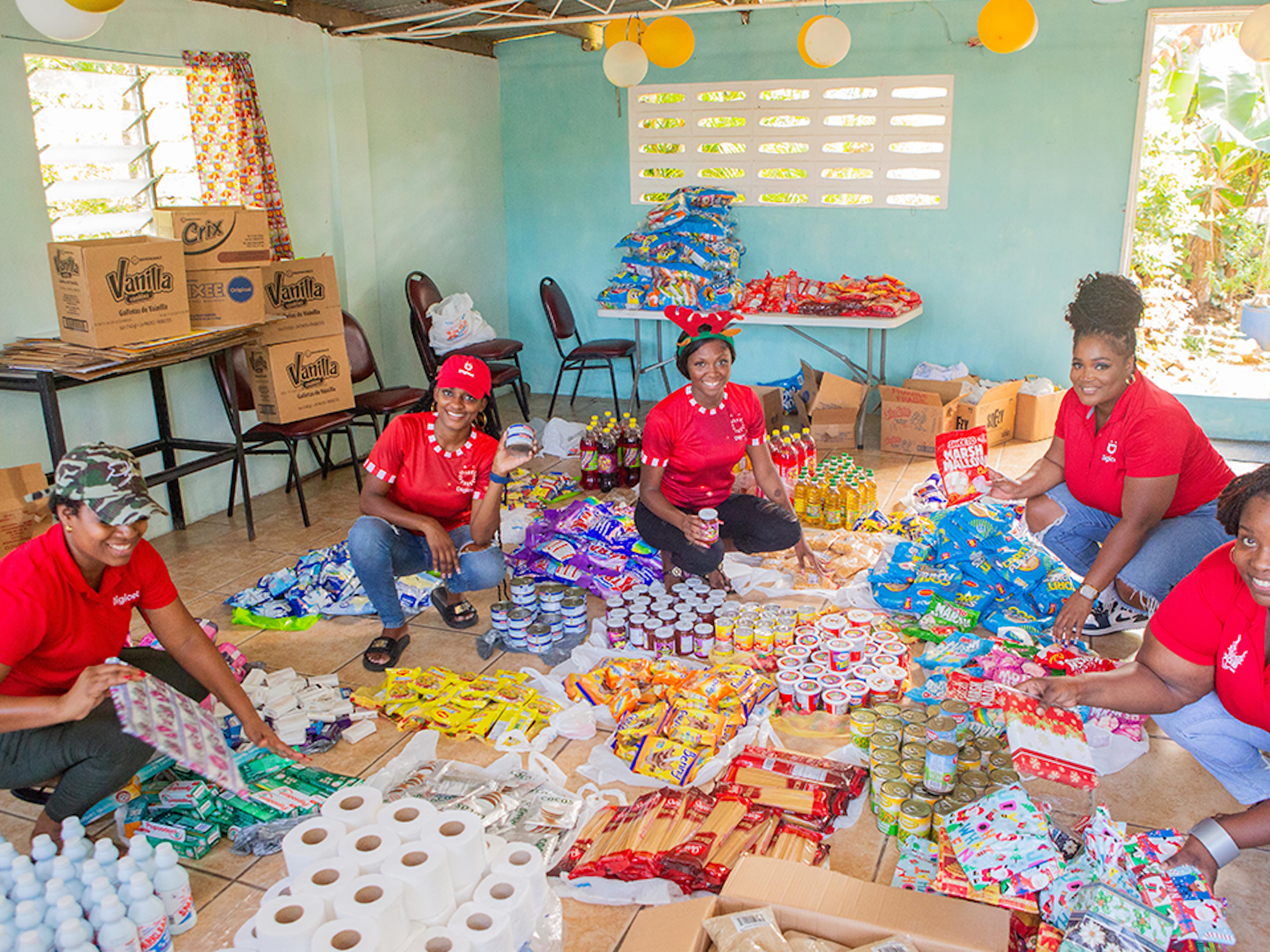 5 women with food hampers