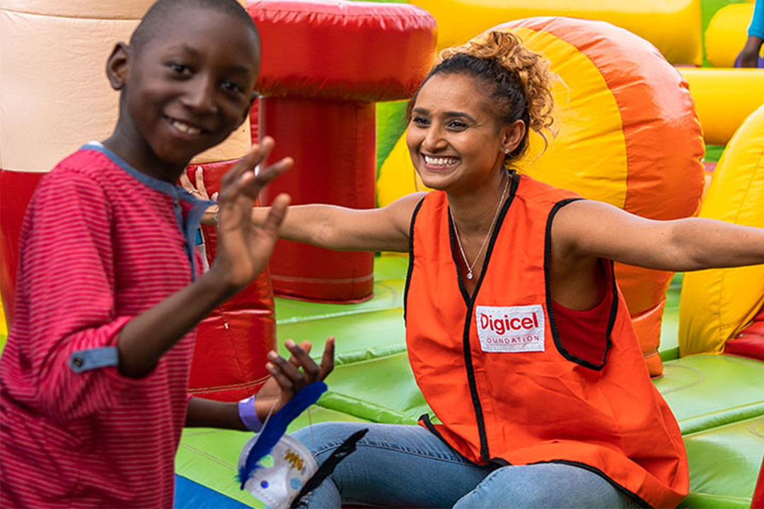 Staff with child at a bouncy castle