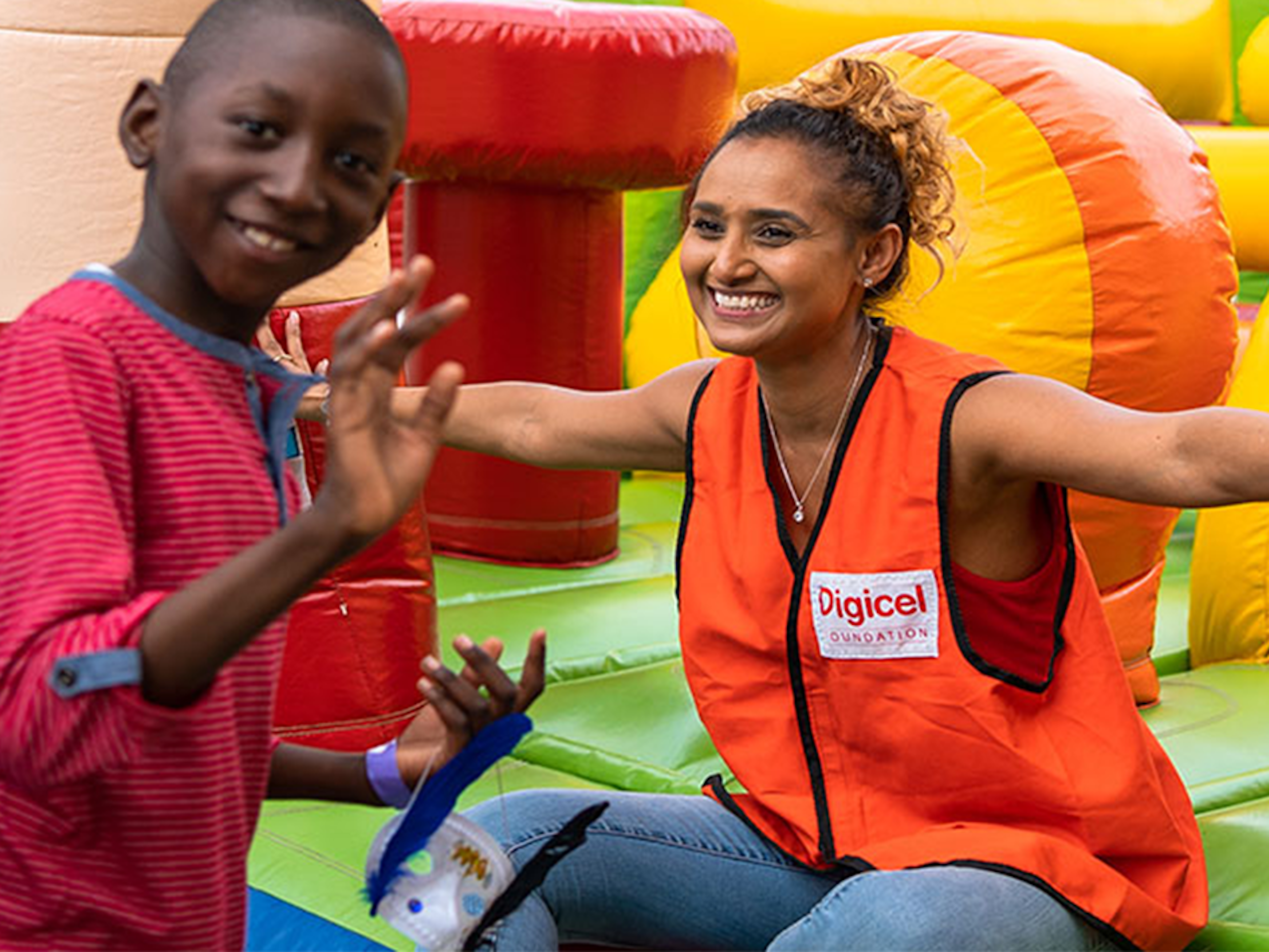 Staff with child at a bouncy castle