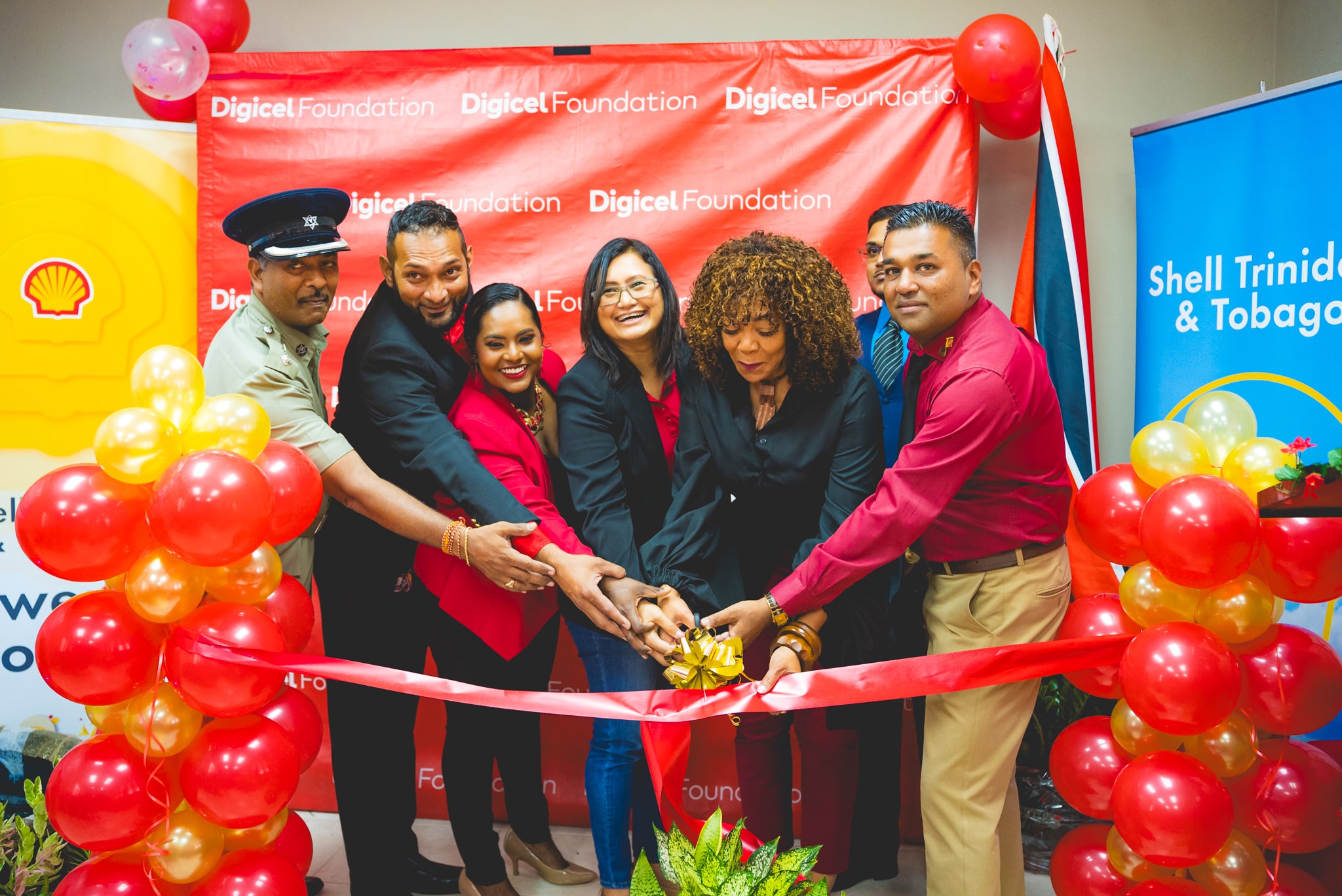 Partners cutting ribbon at a community launch