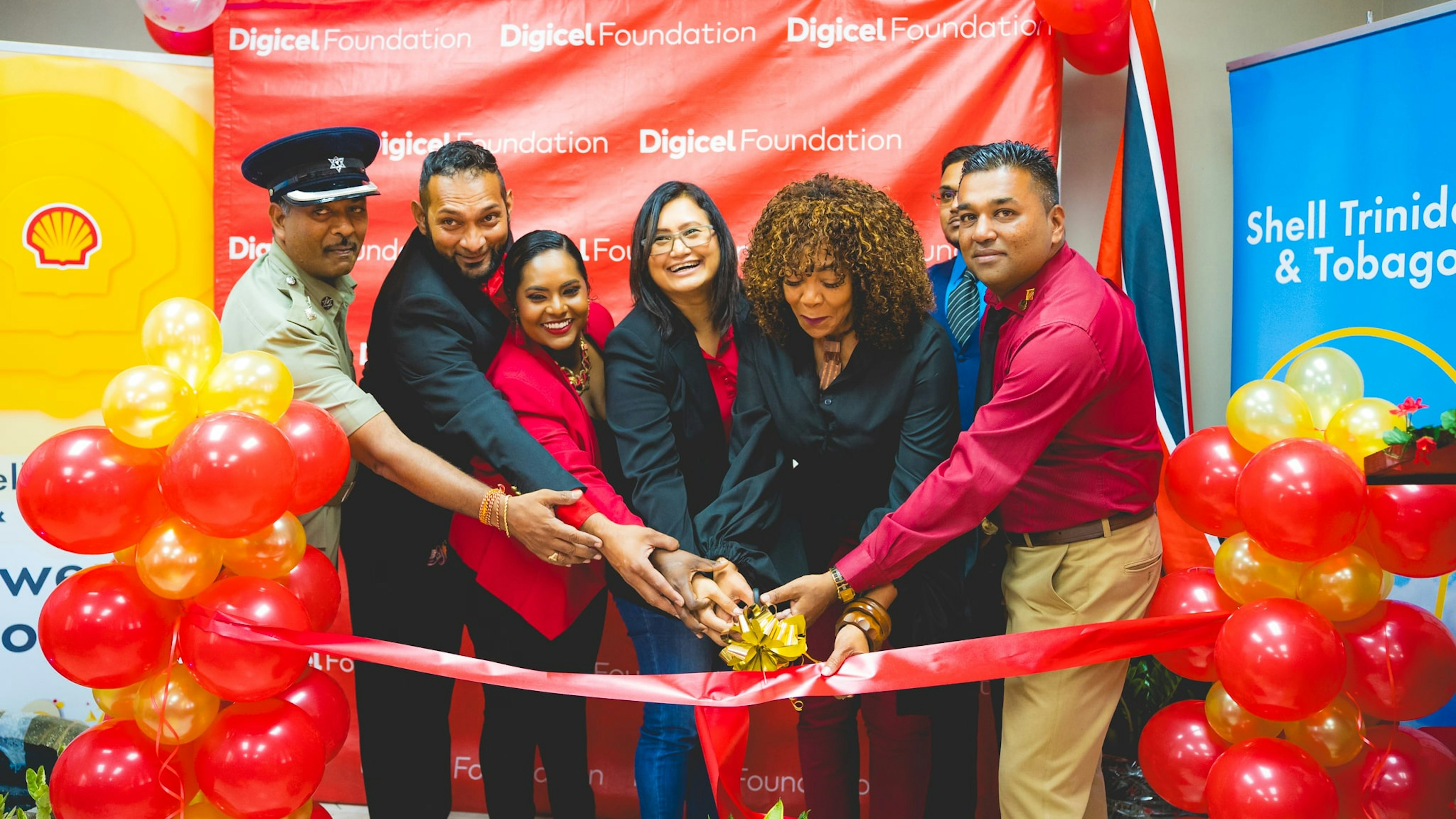 Partners cutting ribbon at a community launch